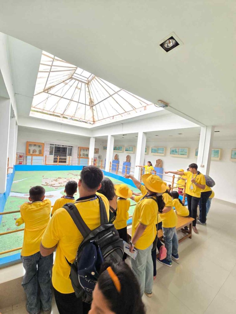 Eduland Montessori roadschooling program Bangalore - children engaged in hands-on experiential learning activities during outdoor educational field trip from Banashankari campus
