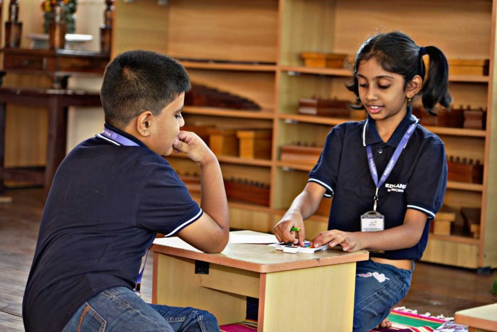 Children collaborating in an Elementary Montessori classroom at Eduland Montessori, Banashankari, Bangalore, developing teamwork, problem-solving, and independent learning skills.